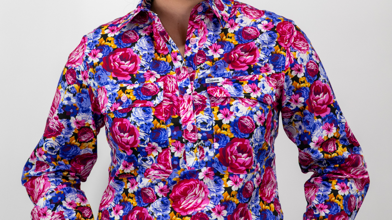 Colorful floral patterned shirt on a plain background
