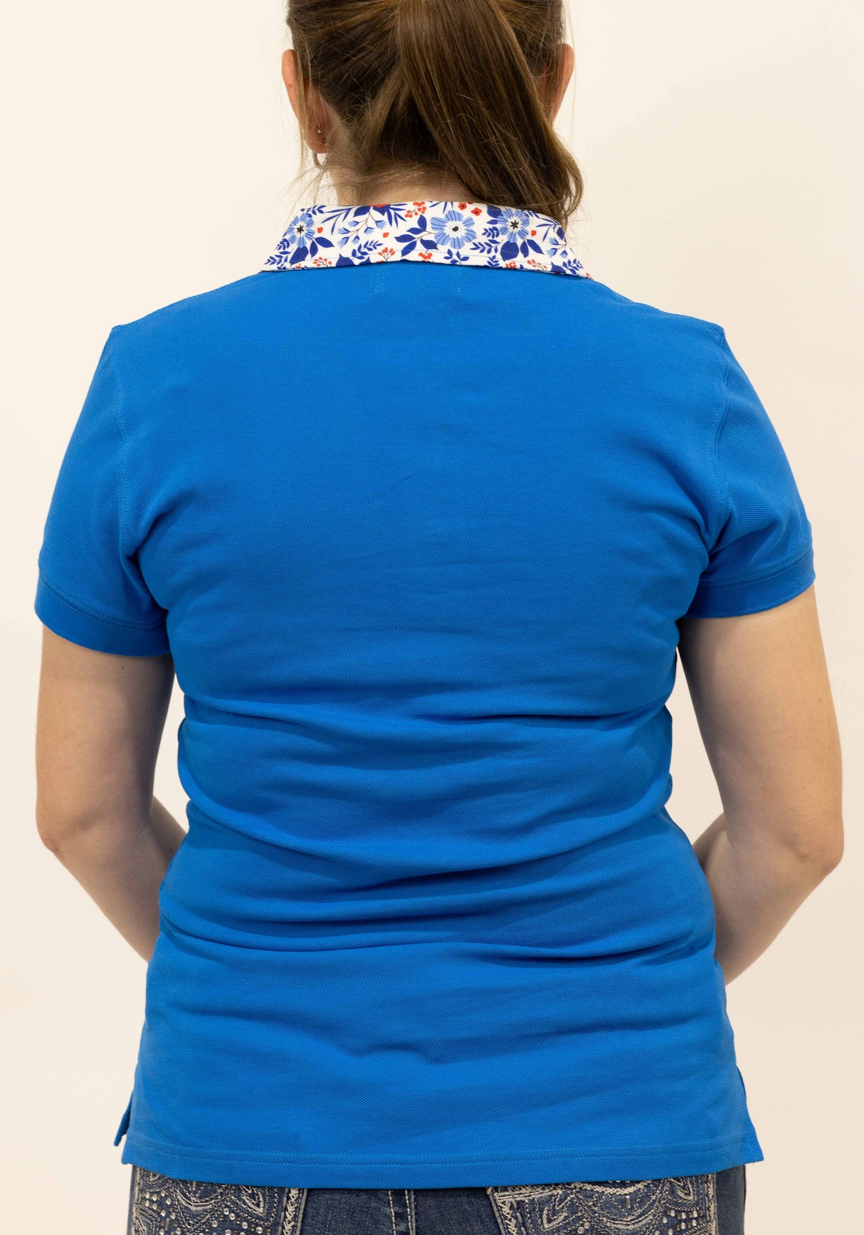 Bee - Blue with floral trim Polo Shirt