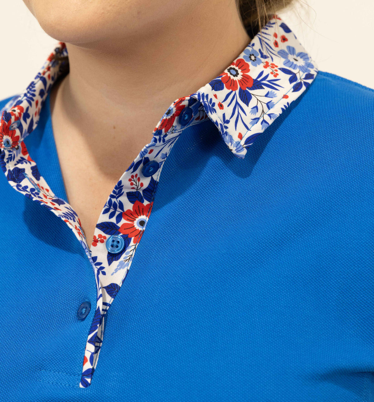 Bee - Blue with floral trim Polo Shirt