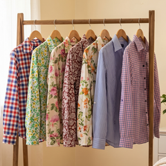 Wooden clothing rack with ladies cotton shirts in a bedroom setting
