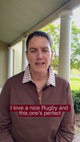 woman talking about a new chocolate brown rugby shirt 